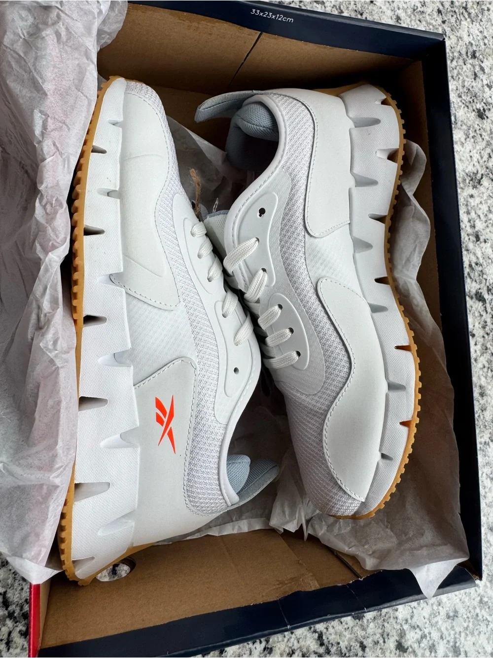 Reebok White and Gray Trail Runner with Orange Logo Accent